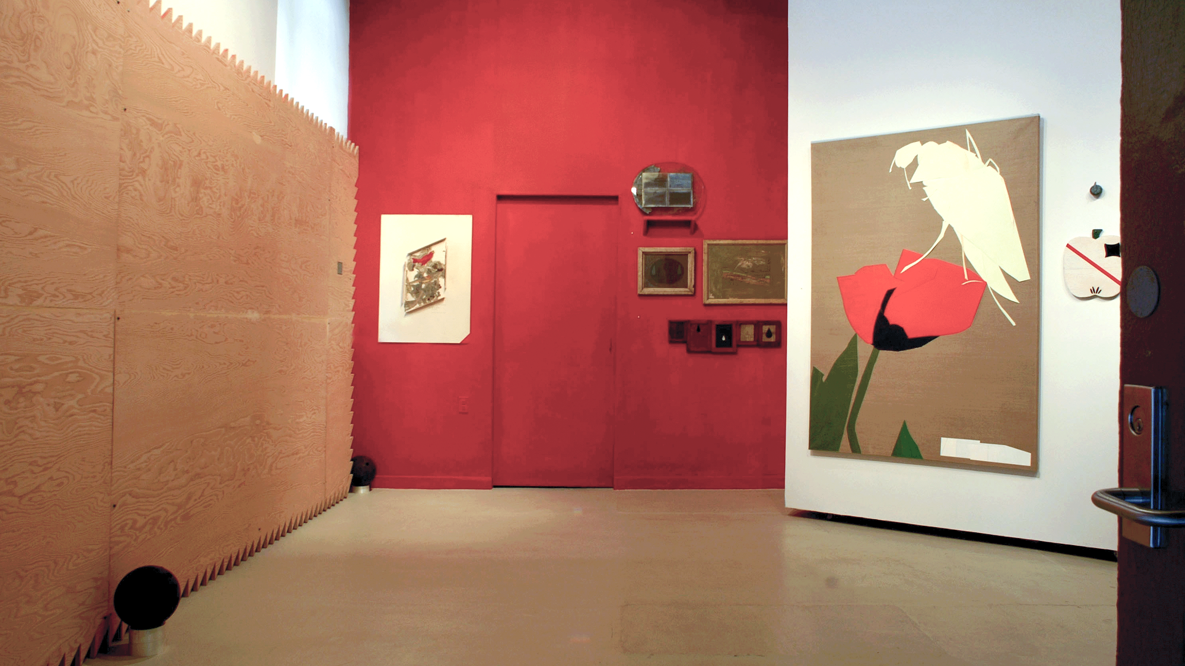 Art installation with red back wall.